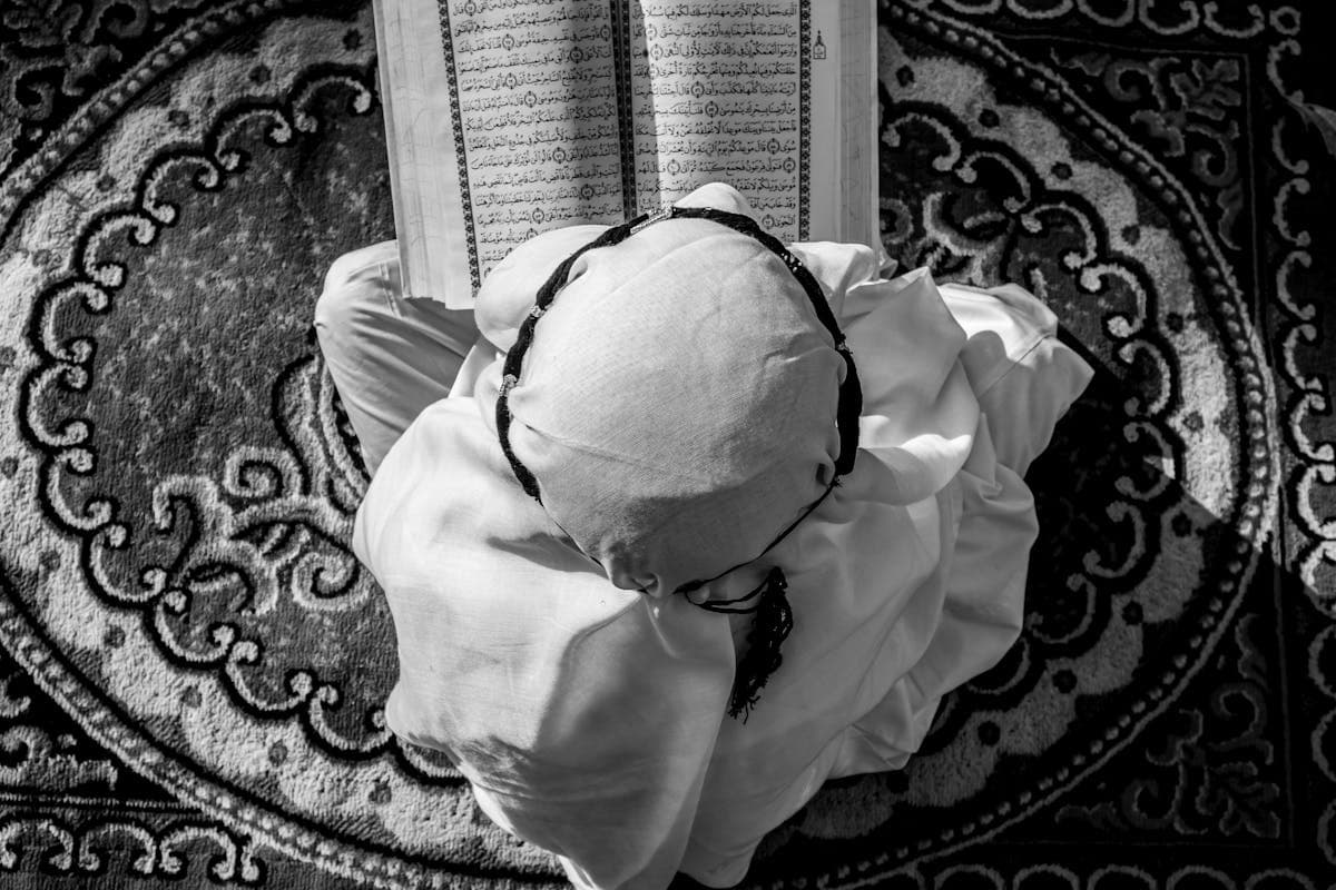 Young boy reading Quran, online Quran class for children