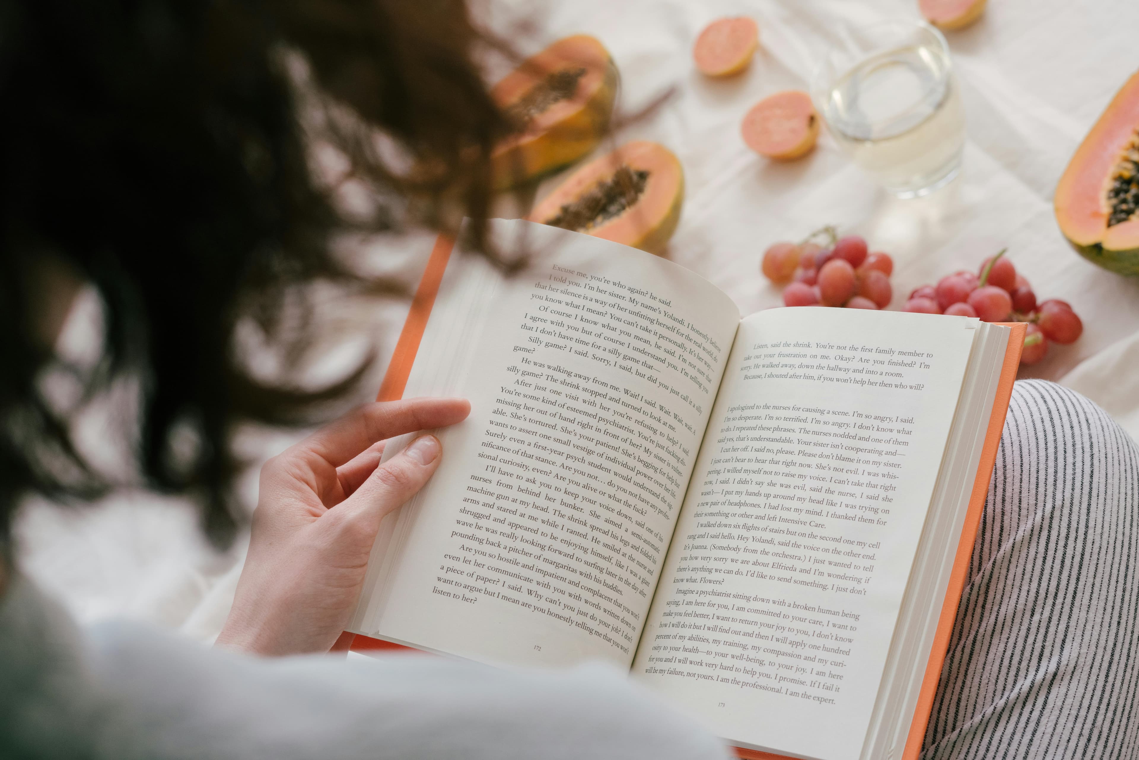 Woman reading a book at home