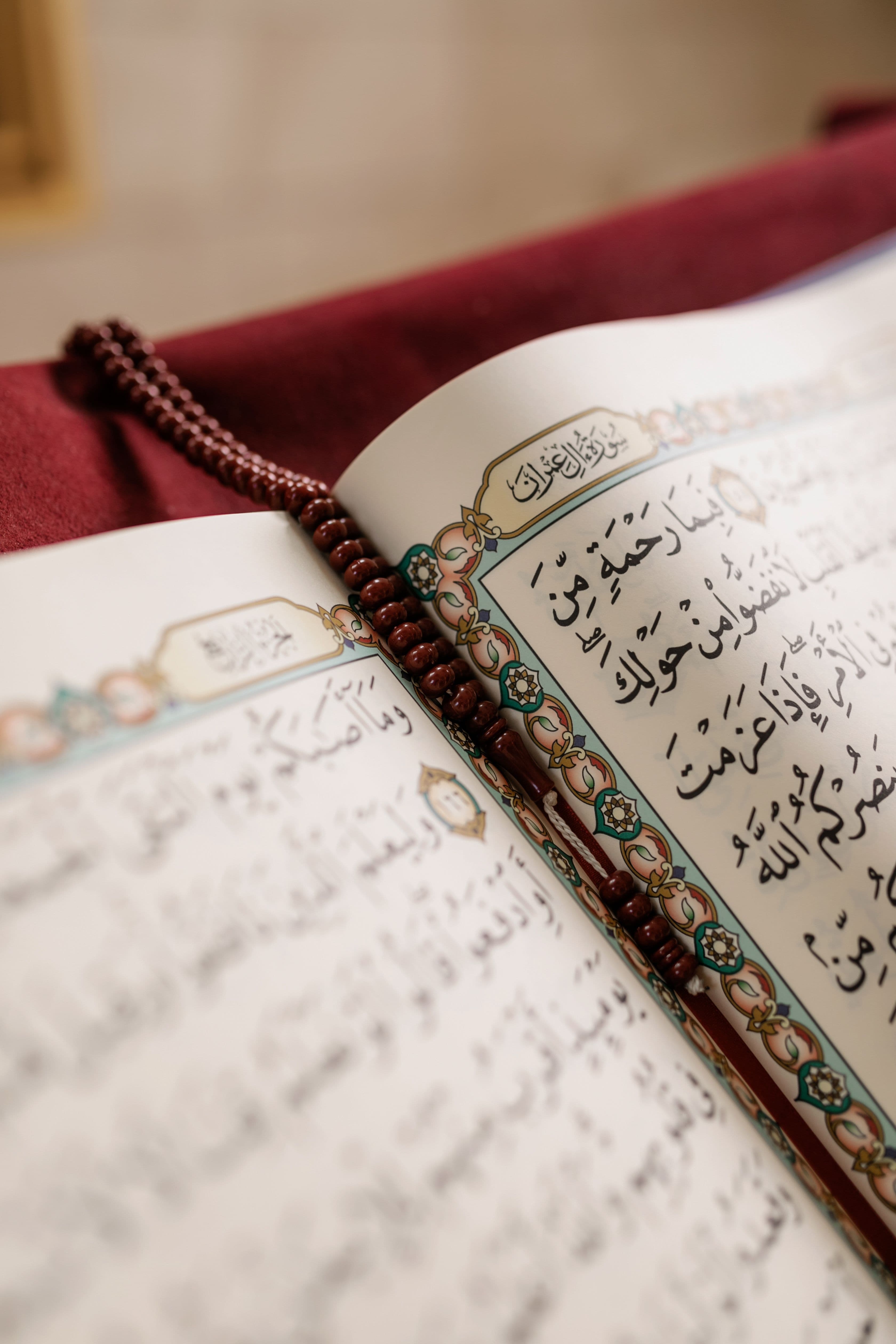 Open Quran on a wooden table
