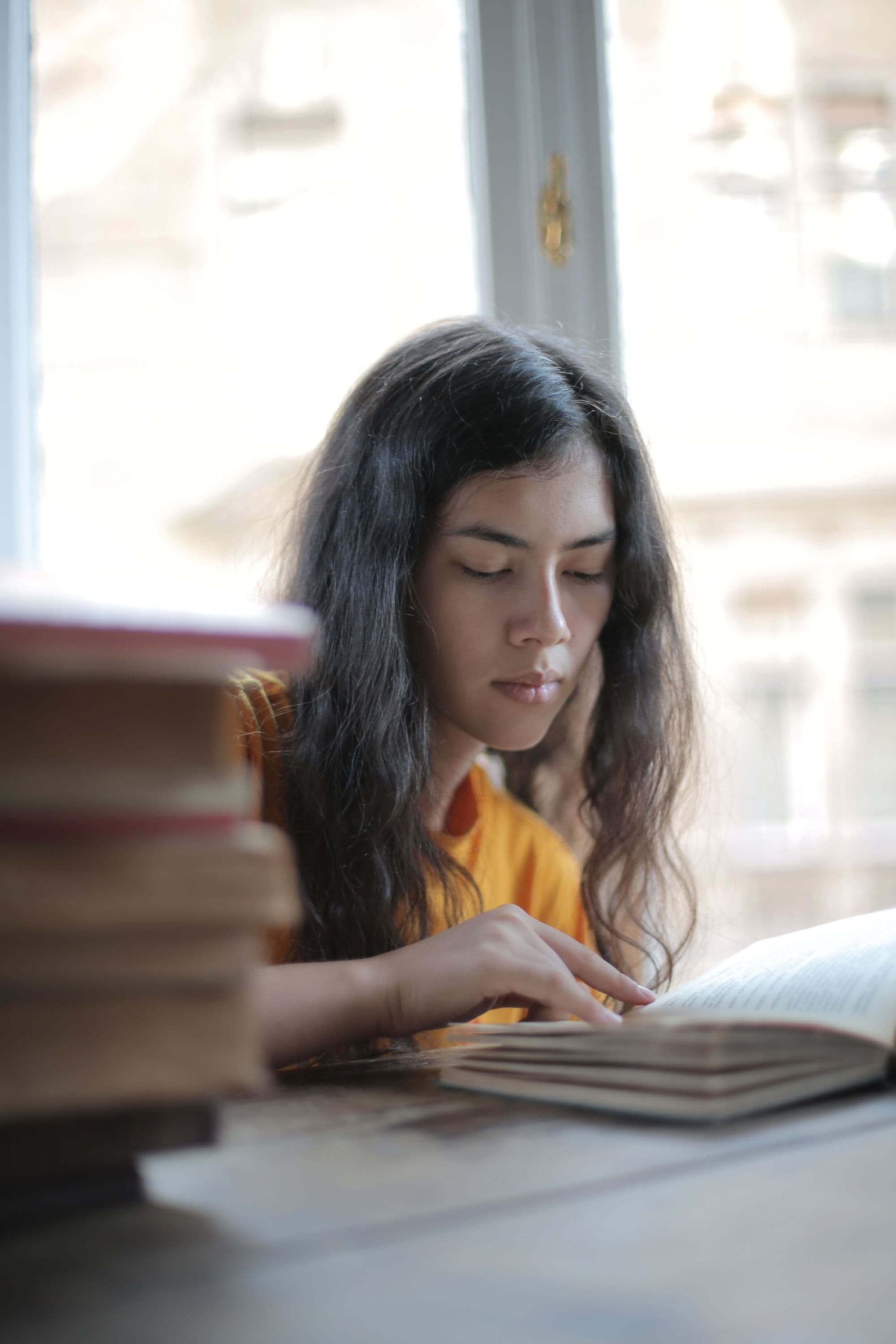 Woman in modest clothing reading