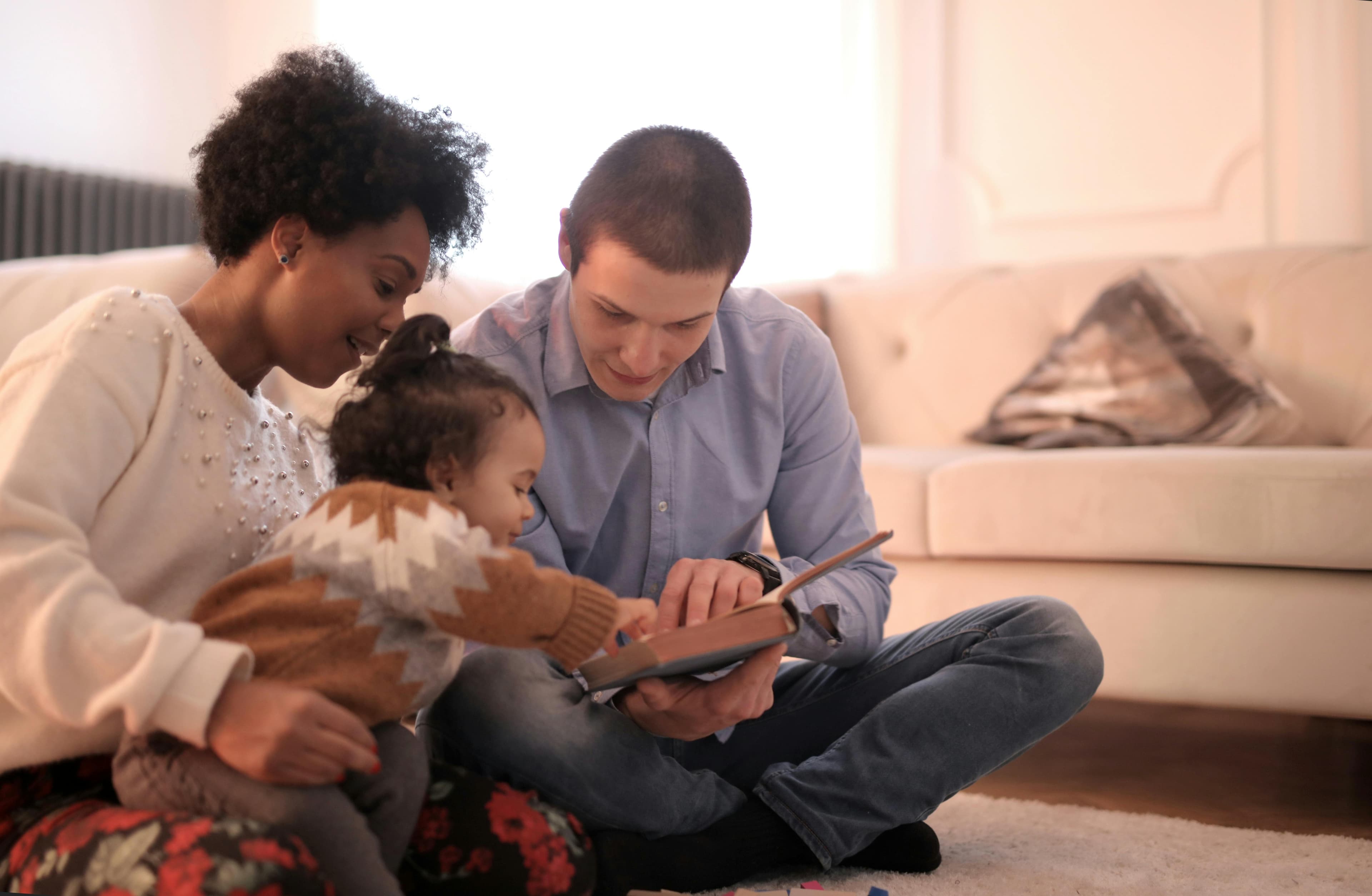 Family reading together at home