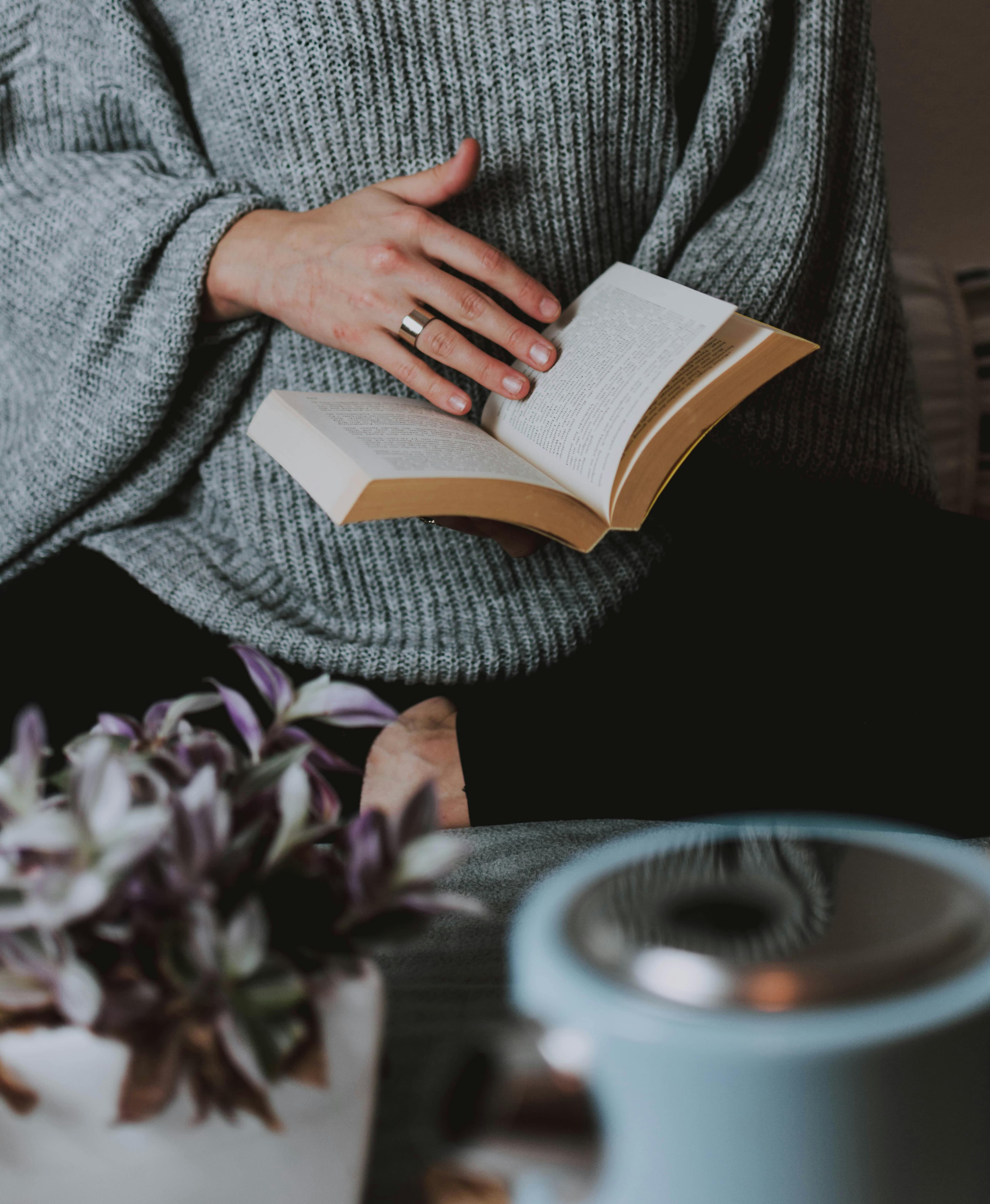 Woman reading thoughtfully